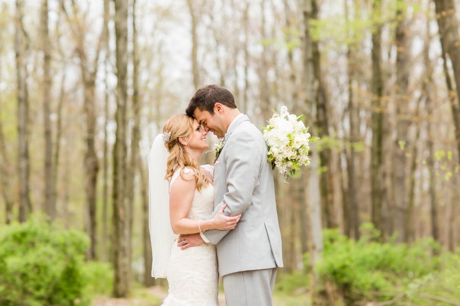 Bride groom forehead to forehead at The Grand Barn Wedding Venue in Ohio