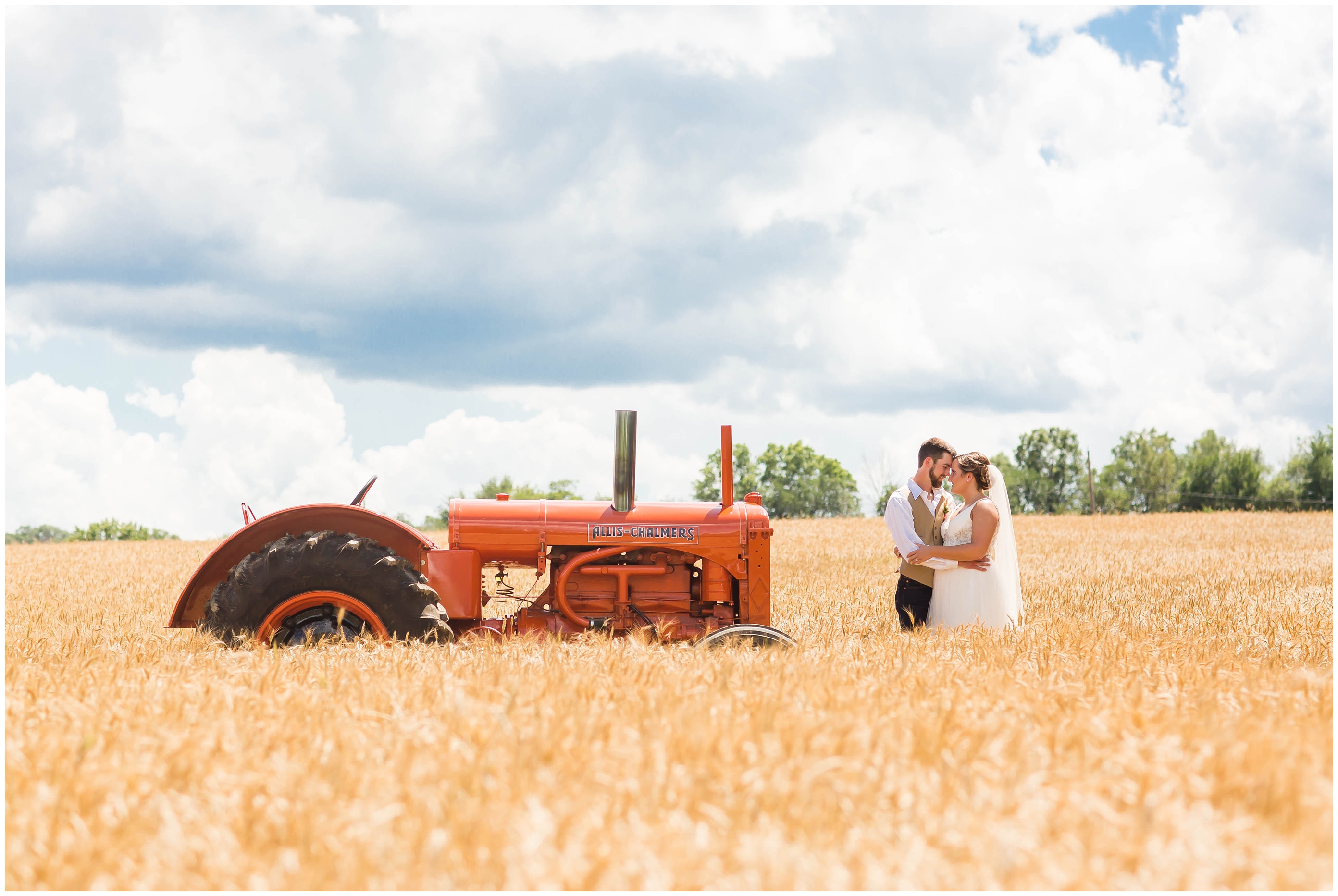Cleveland Wedding Photographer,classic tractor with bride and groom,loren jackson photography,photographer akron ohio,wheat field wedding photos,