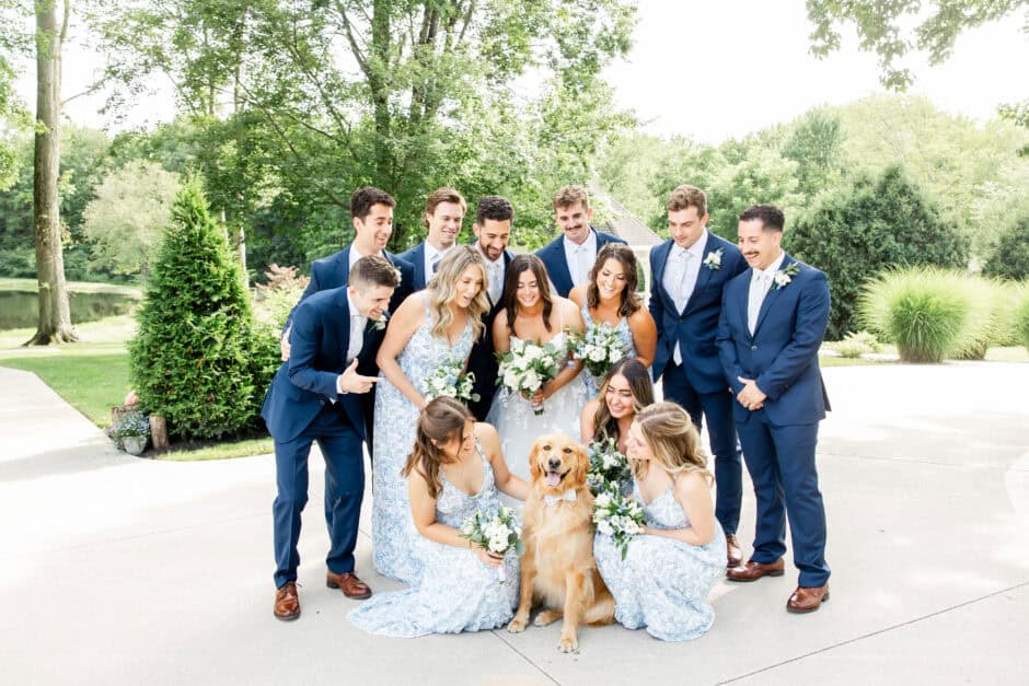 Wedding party gathered outdoors for portraits with bridesmaids, groomsmen, and the couple’s dog, highlighting how structured wedding day schedules allow time for fun and relaxed group photos by Loren Jackson Photography.