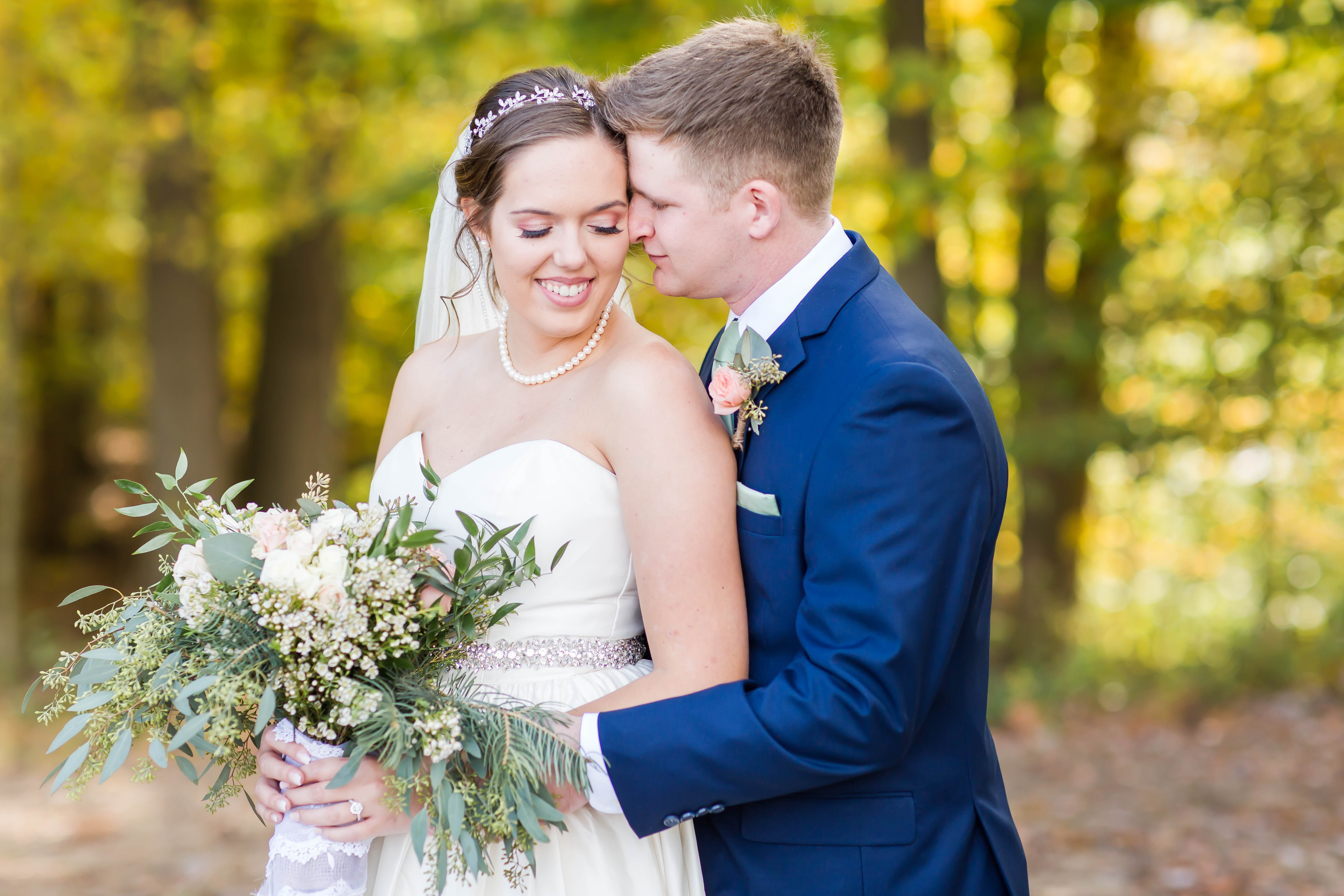 Bride and groom at willow haven farm in wooster ohio on fall wedding day in October photographed by akron ohio wedding photographer